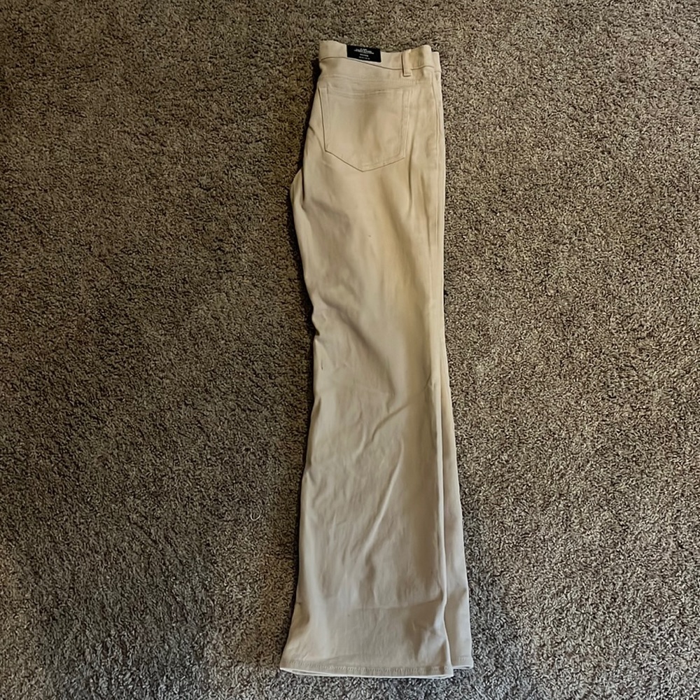 Flare cream jeans, never worn. Bought and were too small